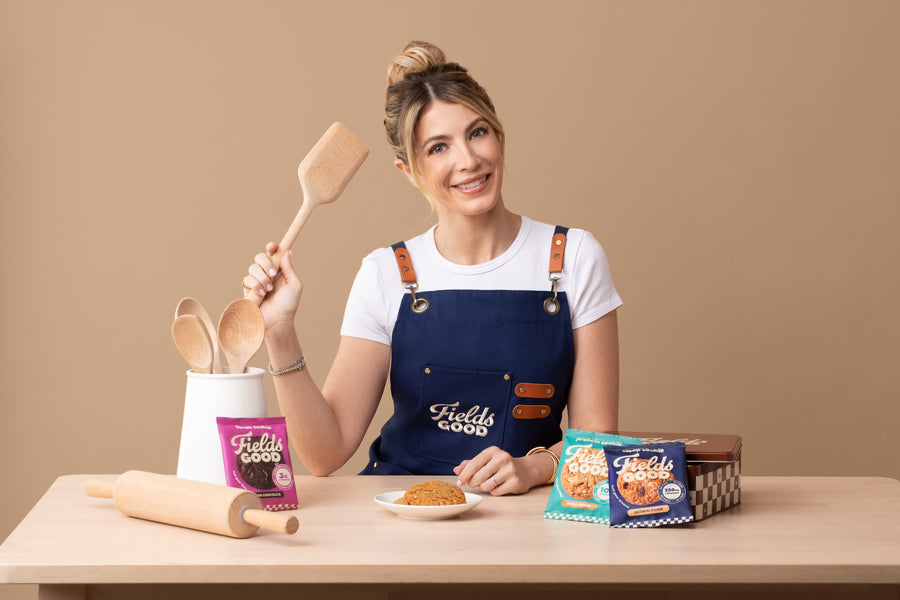 Woman in a kitchen setting with baking tools and 'Fields of Gold' products.