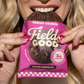 Woman eating a Field Good focus cookie out of the package
