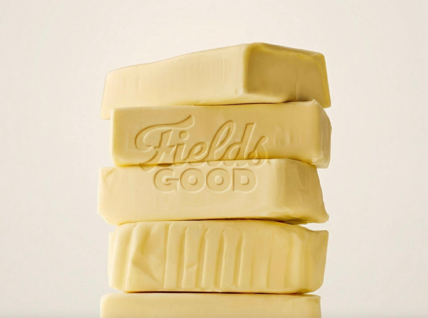 Stack of Fields Good butter on a light background